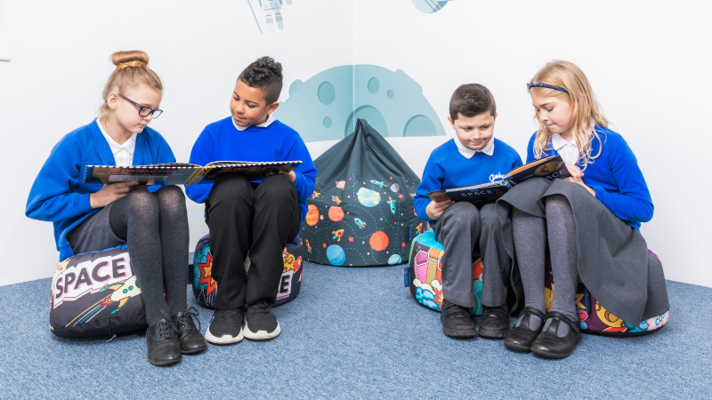 English Lead reveals benefits of Reading Teachers = Reading Pupils scheme Primary curriculum pupils taking time to read together at school.